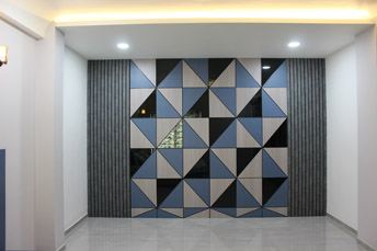 Wall panel with camouflage door by Reflections Interior Studio